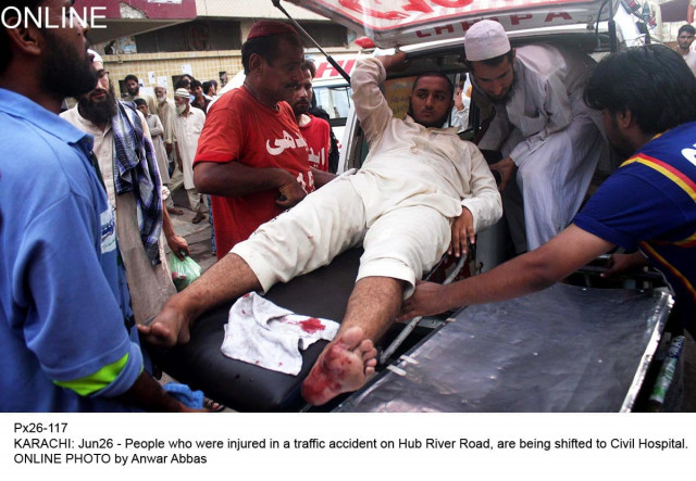 a victim of the accident near hub balochistan is being shifted from the ambulance to the civil hospital in karachi on friday june 26 2015 photo online a victim of the accident near hub balochistan is being shifted from the ambulance to the civil hospital in karachi on friday june 26 2015 photo online