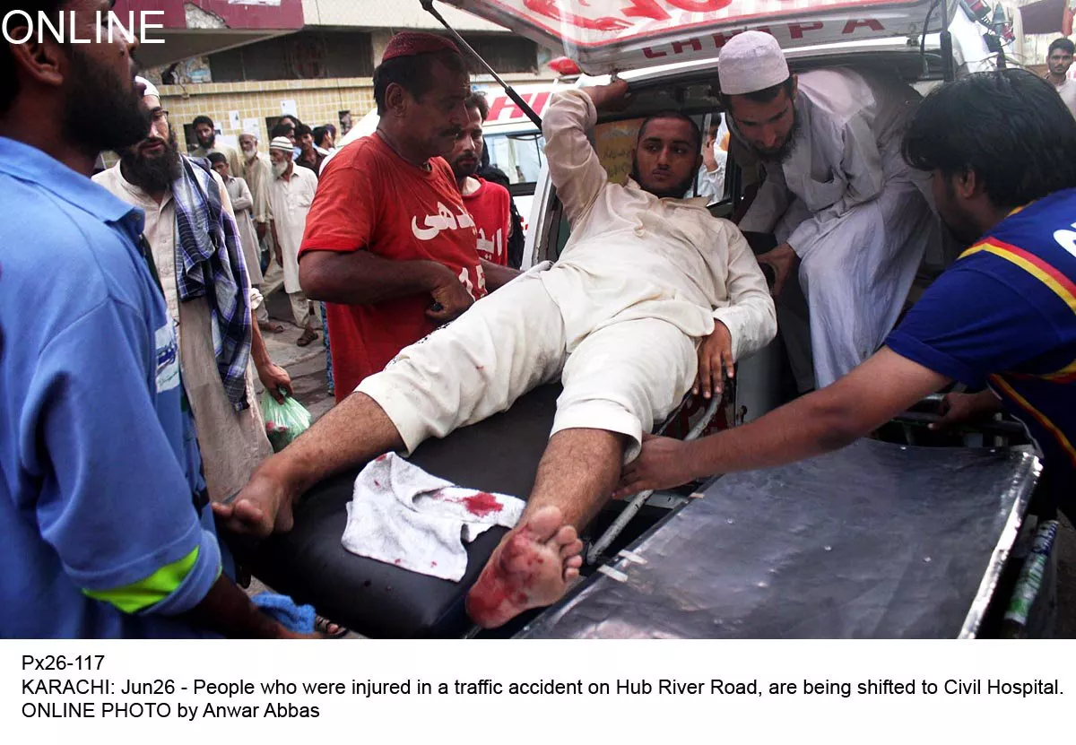 a victim of the accident near hub balochistan is being shifted from the ambulance to the civil hospital in karachi on friday june 26 2015 photo online a victim of the accident near hub balochistan is being shifted from the ambulance to the civil hospital in karachi on friday june 26 2015 photo online