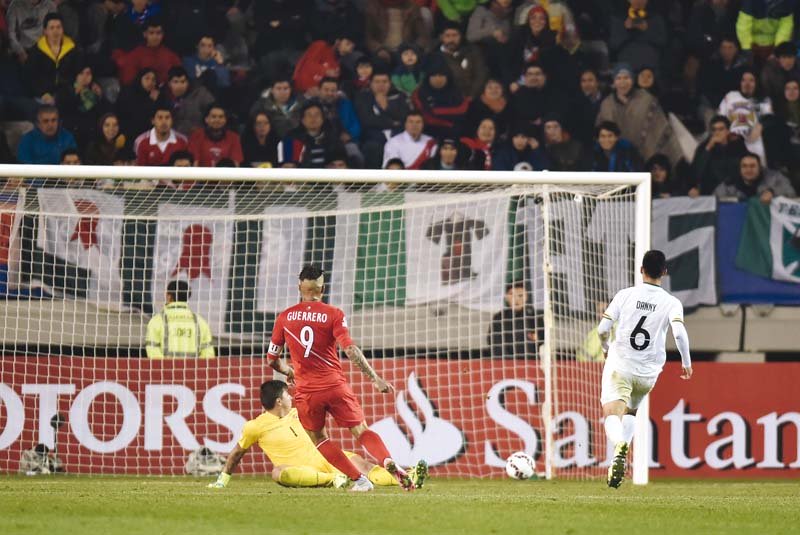 guerrero slots the ball calmly past the bolivian goalkeeper to score his 24th goal for peru closing in on te filo cubillas all time record of 26 goals photo afp