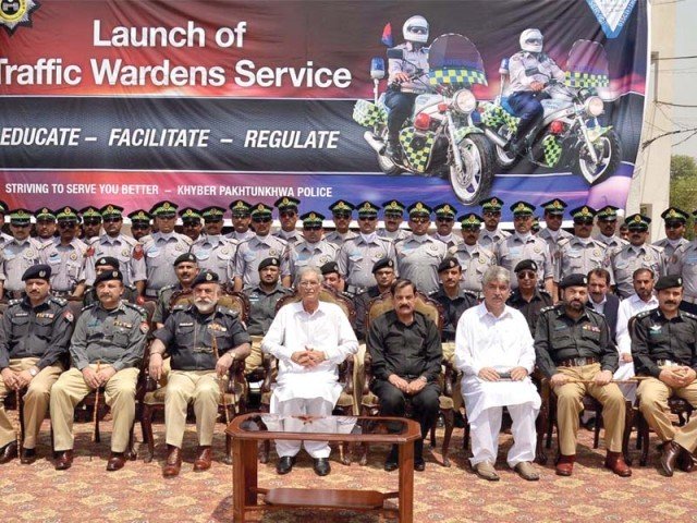 chief minister pervez khattak with the traffic wardens and senior police officials photo inp