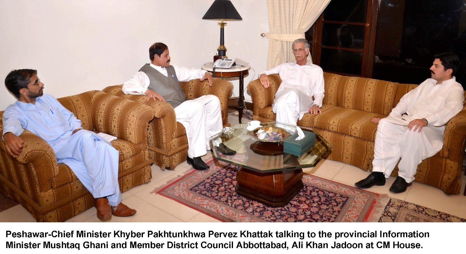 pervez khattak in a meeting with k p information minister mushtaq ghani among others at the cm house in peshawar on friday june 26 2015 photo express