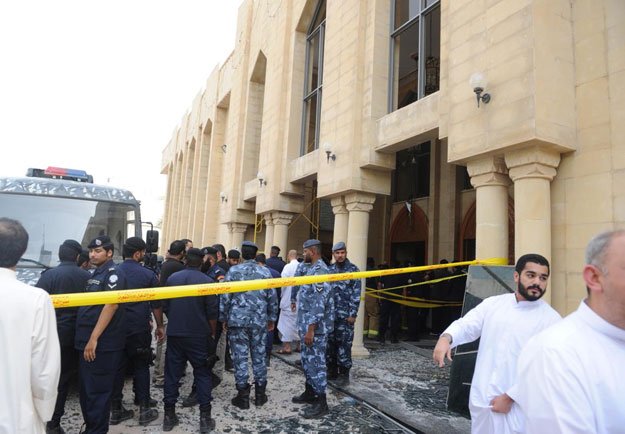 security forces and officials gather at a shia mosque after a deadly blast claimed by the islamic state group that struck worshippers attending friday prayers in kuwait city friday june 26 2015 photo afp