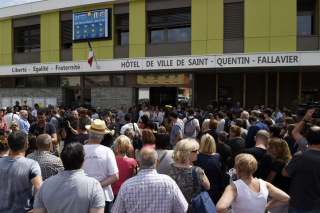 people assemble ahead of a minute of silence outside the city hall of saint quentin fallavier on june 27 2015 in memory to the victims of the attack on us owned air products factory in the town photo afp people assemble ahead of a minute of silence outside the city hall of saint quentin fallavier on june 27 2015 in memory to the victims of the attack on us owned air products factory in the town photo afp