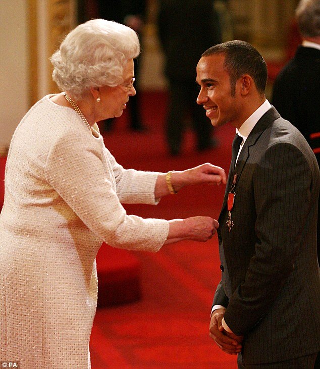 hamilton receiving the mbe from the queen photo courtesy daily mail