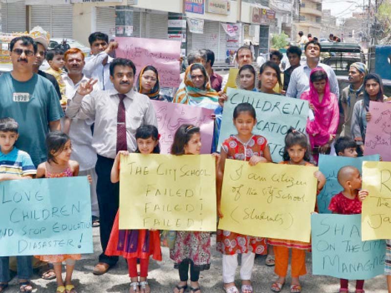 parents children and teachers stage a protest against the closure of the city school branch in jamshoro photo online