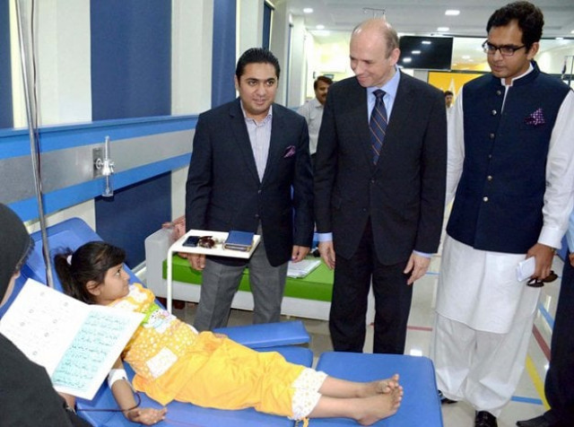 ambassador of belgium h e mr peter claes accompanied by md pakistan bait ul mal barrister abid waheed inquiring about health of thalassaemic child patient during their visit to pakistan thalassaemia centre photo nni ambassador of belgium h e mr peter claes accompanied by md pakistan bait ul mal barrister abid waheed inquiring about health of thalassaemic child patient during their visit to pakistan thalassaemia centre photo nni