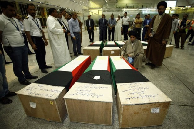 muslim clerics gather over the coffins of eight kuwaitis who lost their lives during the suicide bombing on the al imam al sadeq mosque bombing in kuwait upon their arrival for burial in the holy iraqi city of najaf on june 27 2015 photo afp muslim clerics gather over the coffins of eight kuwaitis who lost their lives during the suicide bombing on the al imam al sadeq mosque bombing in kuwait upon their arrival for burial in the holy iraqi city of najaf on june 27 2015 photo afp