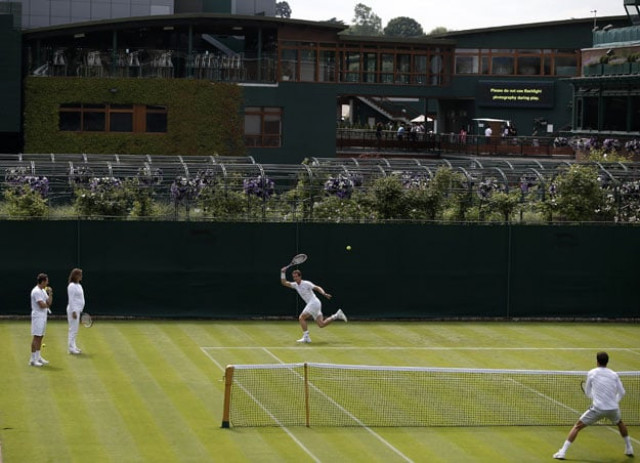 britain 039 s andy murray hits a return while french coach am lie mauresmo 2l and swedish coach jonas bjorkman l look on during a practice session ahead of the wimbledon tennis championships at the all england tennis club in south west london on june 26 2015 photo afp britain 039 s andy murray hits a return while french coach am lie mauresmo 2l and swedish coach jonas bjorkman l look on during a practice session ahead of the wimbledon tennis championships at the all england tennis club in south west london on june 26 2015 photo afp