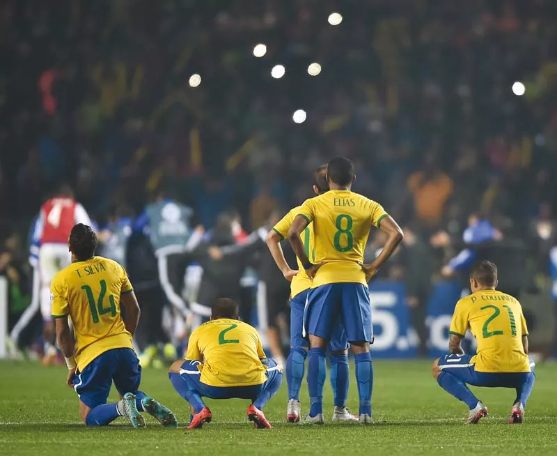 brazil players are dejected after being knocked out on penalties against paraguay photo afp brazil players are dejected after being knocked out on penalties against paraguay photo afp