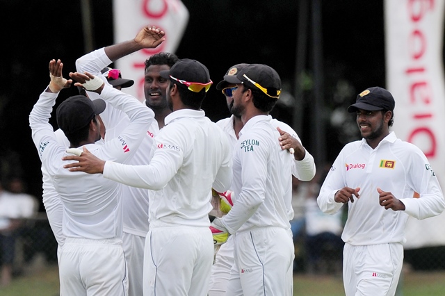 sri lankan captain angelo mathews l celebrates with teammates the wicket of pakistan cricketer younis khan during the fourth day of the second test match between sri lanka and pakistan at the p sara oval cricket stadium in colombo on june 27 2015 photo afp