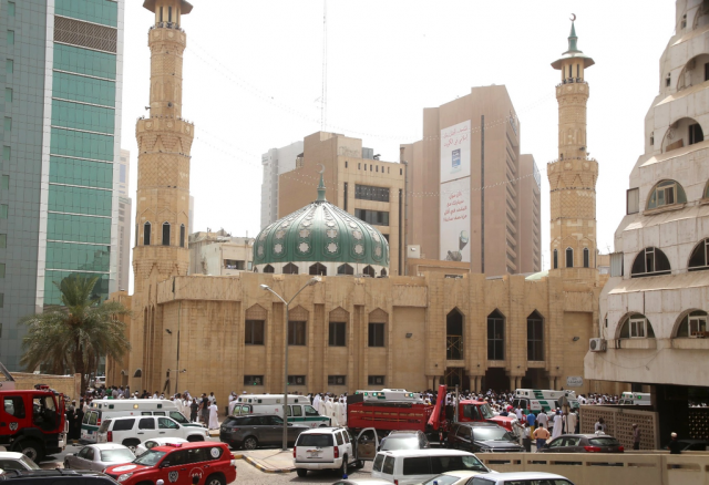 kuwaiti security forces and emergency personnel gather outside the shia al imam al sadeq mosque after it was targeted by a suicide bombing during friday prayers on june 26 2015 in kuwait city photo afp