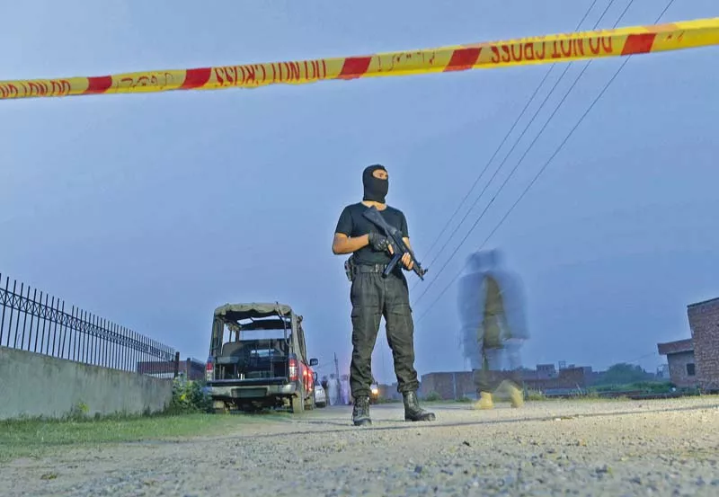 commandos cordon off a house on the outskirts of lahore after four terrorists were killed in a raid photo afp commandos cordon off a house on the outskirts of lahore after four terrorists were killed in a raid photo afp