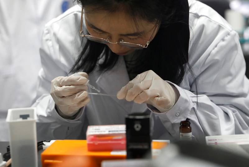 dr shuhui sun performs a step of histological staining of mouse liver for pathological analysis in the aging and regeneration lab at the institute for stem cell and regeneration of the chinese academy of sciences cas in beijing china january 12 2021 picture taken january 12 2021 photo reuters