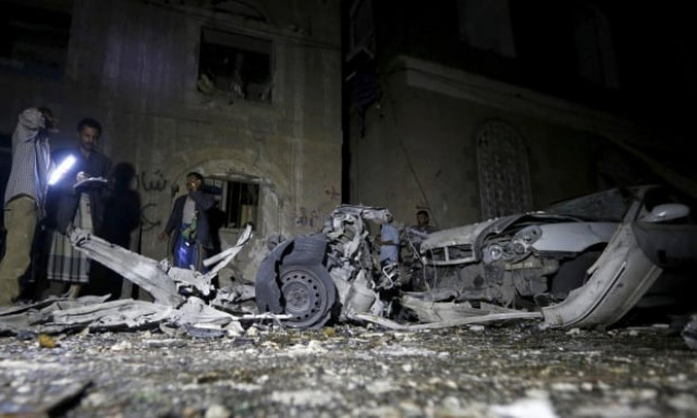 police officers inspect the site of the car bomb attack in yemen s capital sanaa photo reuters police officers inspect the site of the car bomb attack in yemen s capital sanaa photo reuters