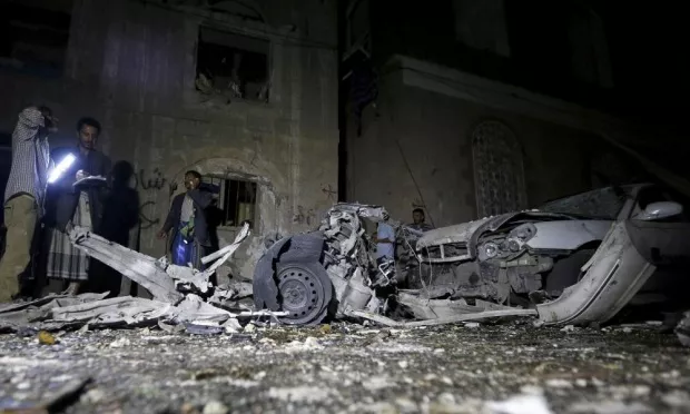 police officers inspect the site of the car bomb attack in yemen s capital sanaa photo reuters police officers inspect the site of the car bomb attack in yemen s capital sanaa photo reuters