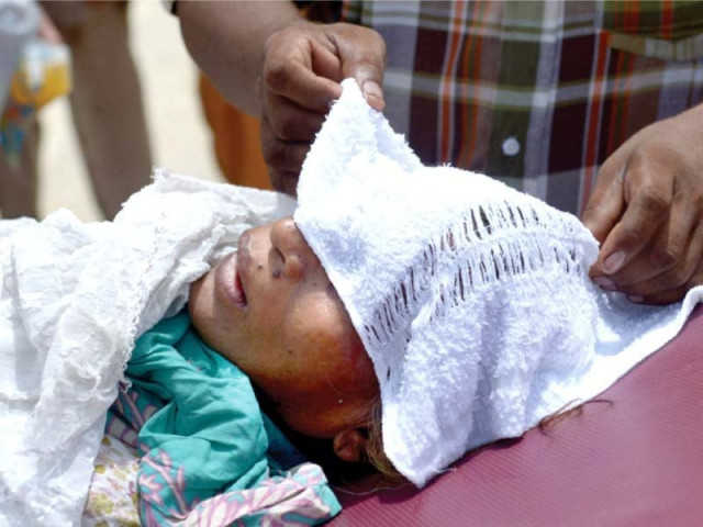 a heatstroke patient lies at a hospital with a wet towel covering her head on tuesday more than 1 200 people have died as a result of the heatwave in karachi so far photo afp a heatstroke patient lies at a hospital with a wet towel covering her head on tuesday more than 1 200 people have died as a result of the heatwave in karachi so far photo afp