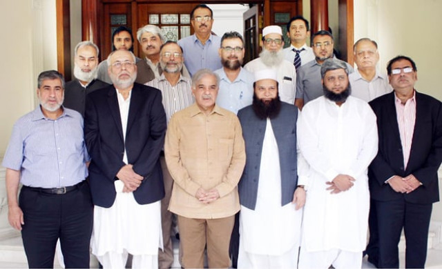 group photo of punjab chief minister shahbaz sharif with board of trustees of tayyip erodgan hospital in muzzafargarh photo inp