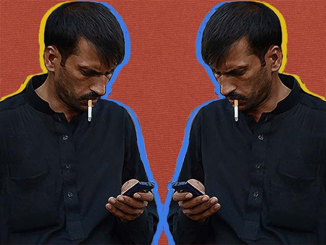 a man checks messages on his mobile phone at a mobile market in rawalpindi photo getty a man checks messages on his mobile phone at a mobile market in rawalpindi photo getty