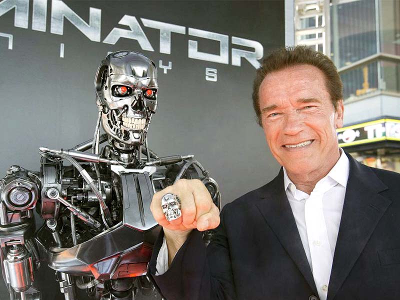 schwarzenegger poses by a terminator replica at the premiere of terminator genisys in hollywood california photo reuters