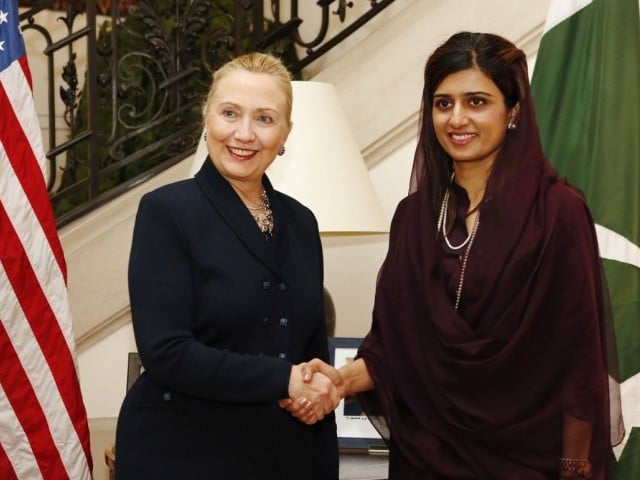 former pakistan foreign minister hina rabbani khar r shakes hands with then us secretary of state hillary clinton l prior to an important meeting in brussels on december 4 2012 photo afp