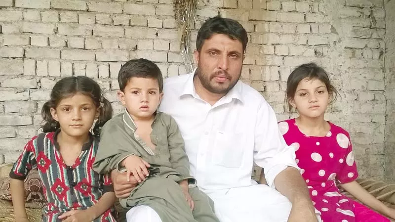 nigar ali with three of his children photo courtesy family nigar ali with three of his children photo courtesy family