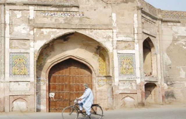 a cyclist passes by an entrance to shalimar gardens photo express ijaz mahmood a cyclist passes by an entrance to shalimar gardens photo express ijaz mahmood