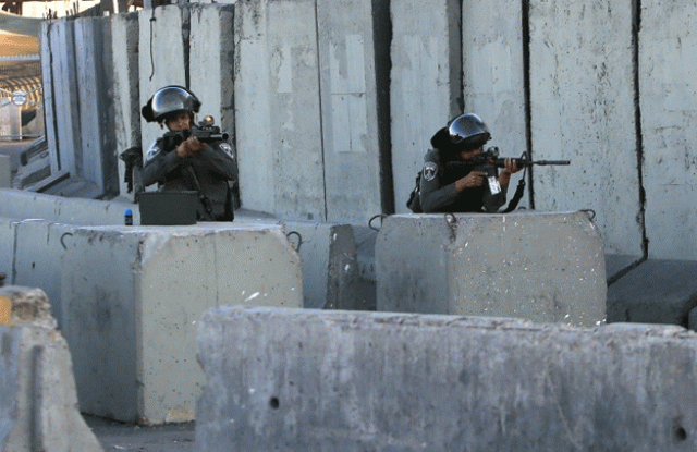 israeli soldiers man the qalandia checkpoint between jerusalem and west bank city of ramallah photo afp