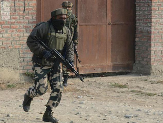 indian soldiers take positions during a gunfight with suspected rebels on the outskirts of srinagar on december 5 2014 photo afp