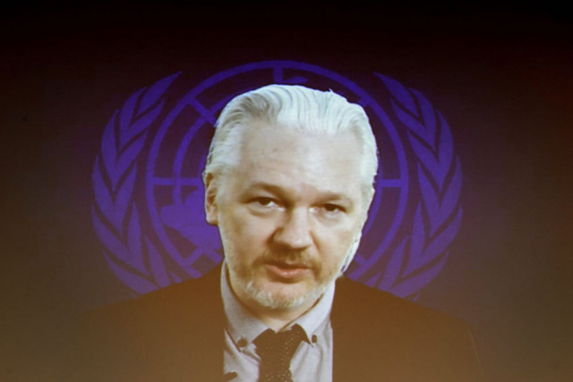 a march 23 2015 file photo shows wikileaks founder julian assange seen on a screen speaking via web cast from the ecuadorian embassy in london during an event on the sideline of the united nations un human rights council session in geneva photo afp