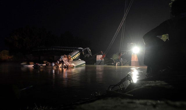 rescue workers and troops inspect the wreckage of a train carrying soldiers and military hardware after it fell into a canal following the partial collapse of a bridge in wazirabad photo afp rescue workers and troops inspect the wreckage of a train carrying soldiers and military hardware after it fell into a canal following the partial collapse of a bridge in wazirabad photo afp