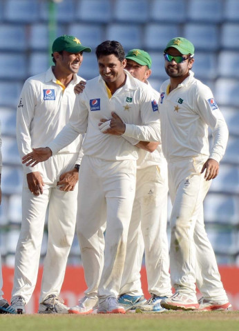 azhar is congratulated by yasir after he provided unlikely impetus to pakistan by picking up two wickets off two balls photo afp azhar is congratulated by yasir after he provided unlikely impetus to pakistan by picking up two wickets off two balls photo afp