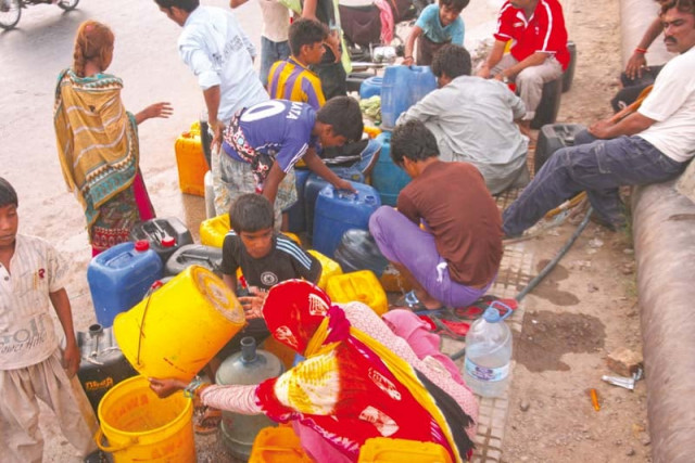 people wait with empty containers to fill them with water as the city faces an acute shortage water is sold at exorbitant rates by owners of tankers and illegal water hydrants dozens of which operate in the city photo athar khan express people wait with empty containers to fill them with water as the city faces an acute shortage water is sold at exorbitant rates by owners of tankers and illegal water hydrants dozens of which operate in the city photo athar khan express