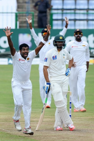 sri lanka 039 s cricketer dhammika prasad c successfully appeals for a leg before wicket lbw decision against pakistan cricketer shan masood c during the second day of the third and final test match between sri lanka and pakistan at the pallekele international cricket stadium in pallekele on july 4 2015 photo afp sri lanka 039 s cricketer dhammika prasad c successfully appeals for a leg before wicket lbw decision against pakistan cricketer shan masood c during the second day of the third and final test match between sri lanka and pakistan at the pallekele international cricket stadium in pallekele on july 4 2015 photo afp