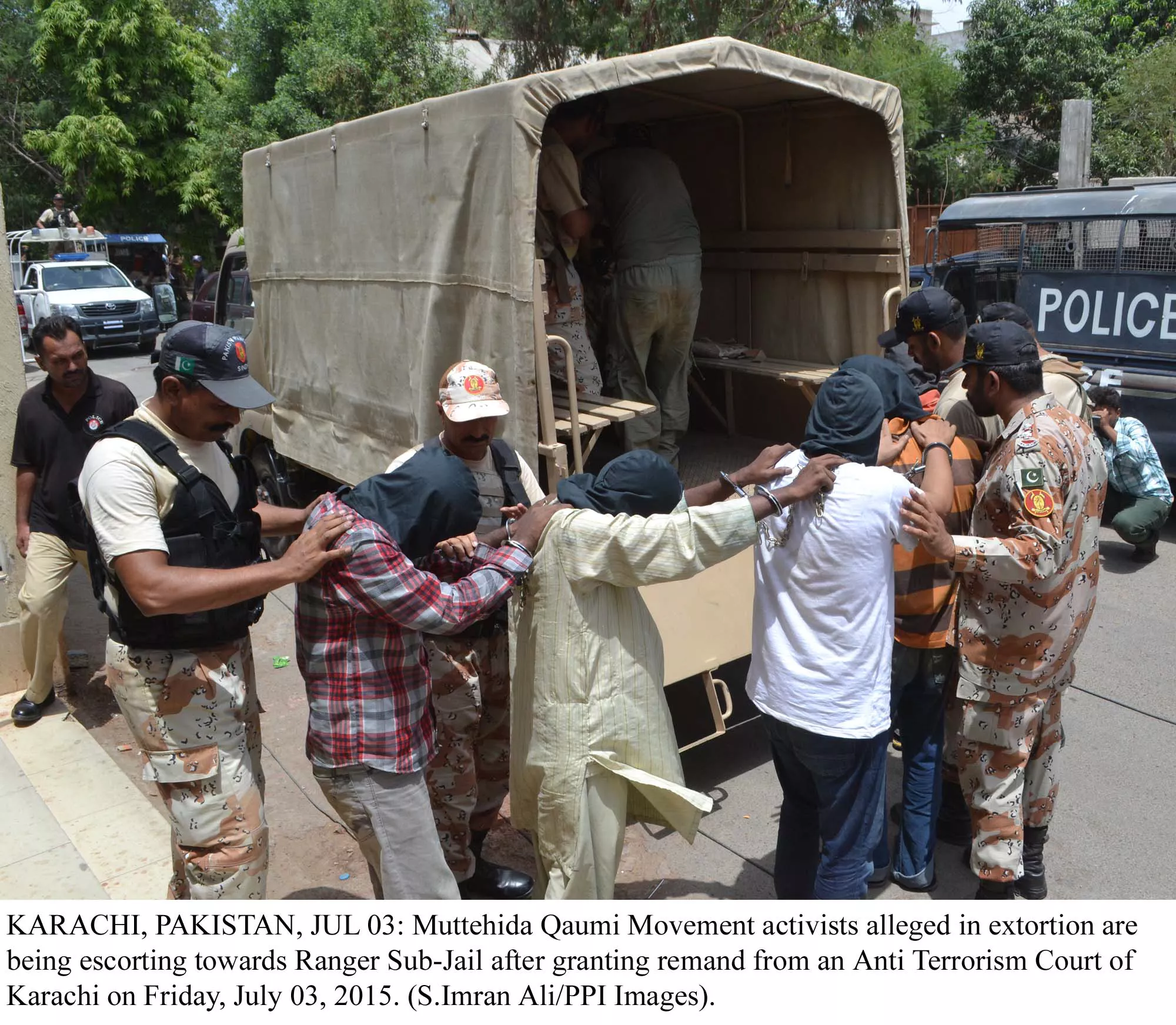 rangers load suspects arrested after a raid into trucks in karachi photo ppi rangers load suspects arrested after a raid into trucks in karachi photo ppi