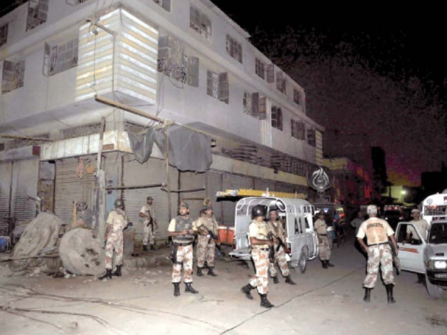 rangers personnel stand guard at the shershah scrap market after it was attacked over an extortion dispute in october 2010 at least 12 people were killed while a dozen others were left wounded photo file rangers personnel stand guard at the shershah scrap market after it was attacked over an extortion dispute in october 2010 at least 12 people were killed while a dozen others were left wounded photo file