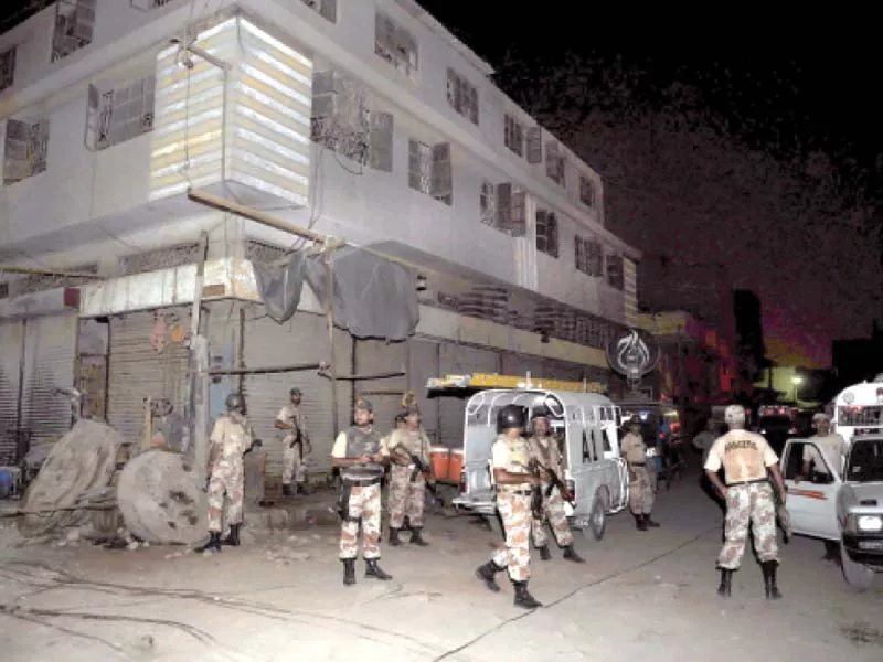 rangers personnel stand guard at the shershah scrap market after it was attacked over an extortion dispute in october 2010 at least 12 people were killed while a dozen others were left wounded photo file rangers personnel stand guard at the shershah scrap market after it was attacked over an extortion dispute in october 2010 at least 12 people were killed while a dozen others were left wounded photo file
