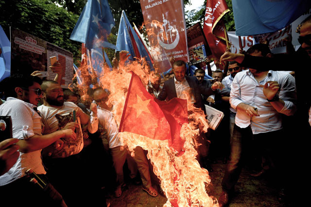 turkish nationalists burn a chinese flag during a protest to denounce china 039 s treatment of ethnic uighur muslims in front of the chinese consulate in istanbul on july 5 2015 photo afp turkish nationalists burn a chinese flag during a protest to denounce china 039 s treatment of ethnic uighur muslims in front of the chinese consulate in istanbul on july 5 2015 photo afp