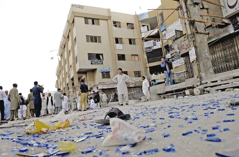 people gather at the site of the bomb blast in quetta photo afp people gather at the site of the bomb blast in quetta photo afp
