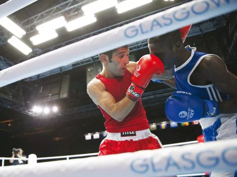 pakistan s muhammad waseem red fights during the men s fly 52 kg semi final boxing match at the 2014 commonwealth games in glasgow scotland photo file pakistan s muhammad waseem red fights during the men s fly 52 kg semi final boxing match at the 2014 commonwealth games in glasgow scotland photo file