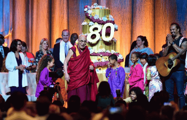 the dalai lama reacts as his birthday cake is wheeled out on stage following a performance for him by children at the honda center in anaheim california on july 5 2015 photo afp the dalai lama reacts as his birthday cake is wheeled out on stage following a performance for him by children at the honda center in anaheim california on july 5 2015 photo afp