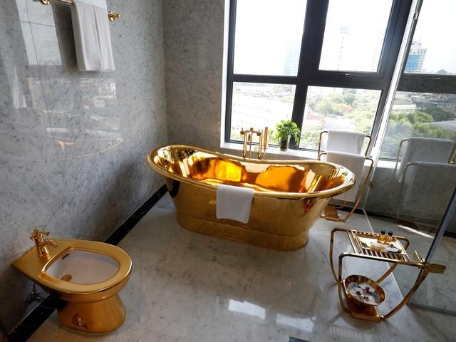 A gold plated bathtub and a gold plated toilet are seen in the newly-inaugurated Dolce Hanoi Golden Lake luxury hotel in Hanoi, Vietnam. PHOTO: REUTERS