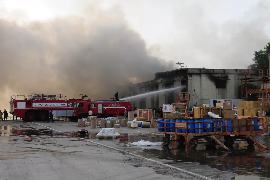 firefighters extinguish fires after militants attack jinnah international airport in karachi on june 9 2014 photo afp firefighters extinguish fires after militants attack jinnah international airport in karachi on june 9 2014 photo afp