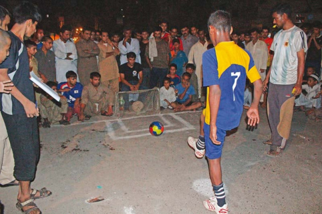 football remains the most popular street game played during the night in lyari photo courtesy dilshar baloch