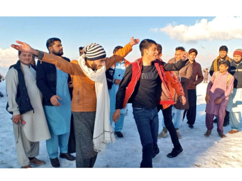 a group of youngsters dances at laram top in dir lower photo express