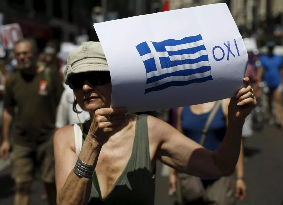a woman holds a placard with a greek national flag next to a message in greek reading quot no quot during a rally in support of greece in madrid july 5 2015 photo reuters a woman holds a placard with a greek national flag next to a message in greek reading quot no quot during a rally in support of greece in madrid july 5 2015 photo reuters
