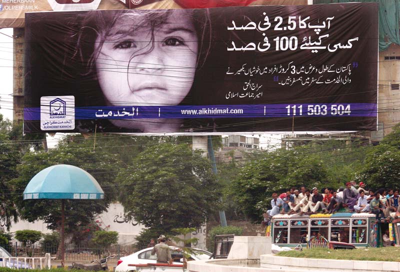 as the rangers have started a crackdown against political parties collecting fitra and zakat alkhidmat foundation like many other welfare organisations puts up a billboard calling for people to donate for the poor photo athar khan express