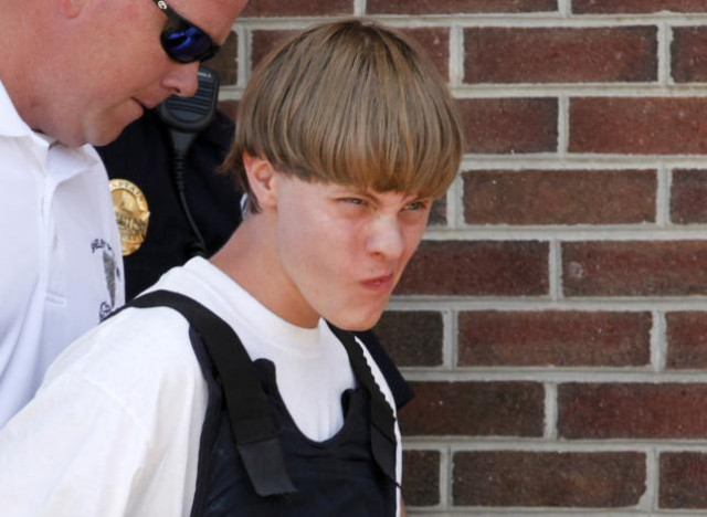 police lead suspected shooter dylann roof 21 into the courthouse in shelby north carolina june 18 2015 photo reuters police lead suspected shooter dylann roof 21 into the courthouse in shelby north carolina june 18 2015 photo reuters