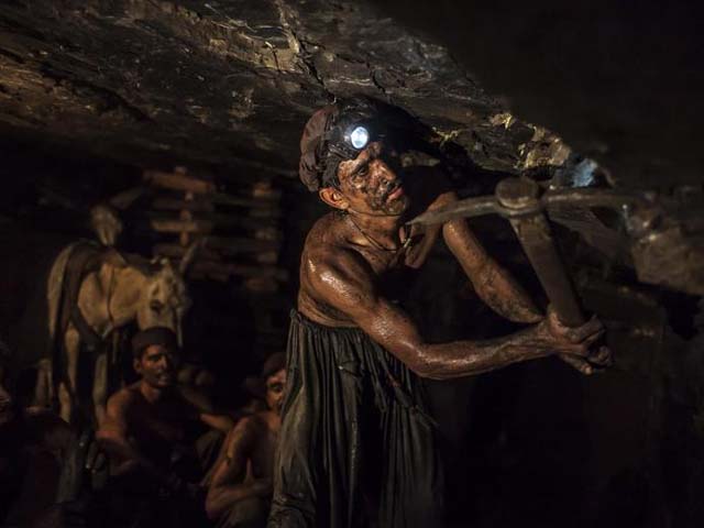 miner mohammad ismail 25 digs in a coal mine in choa saidan shah photo reuters