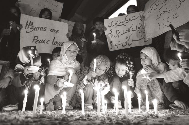 hazaras light candles for peace against sectarian attacks in quetta on february 15 2014 photo reuters