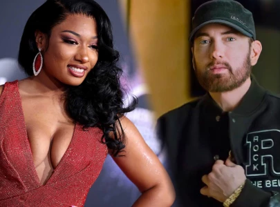 eminem s new track sparks backlash with megan thee stallion shooting reference